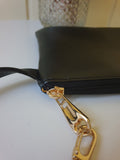 The "Clip & zip"  wristlet bag